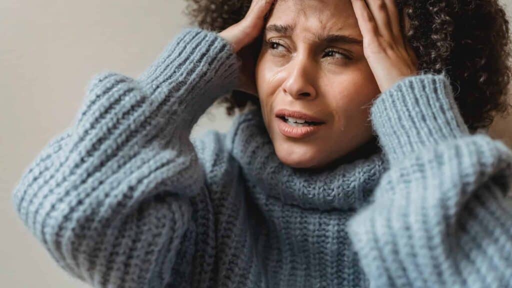 Disappointed Black Woma Crying with Hands on Head