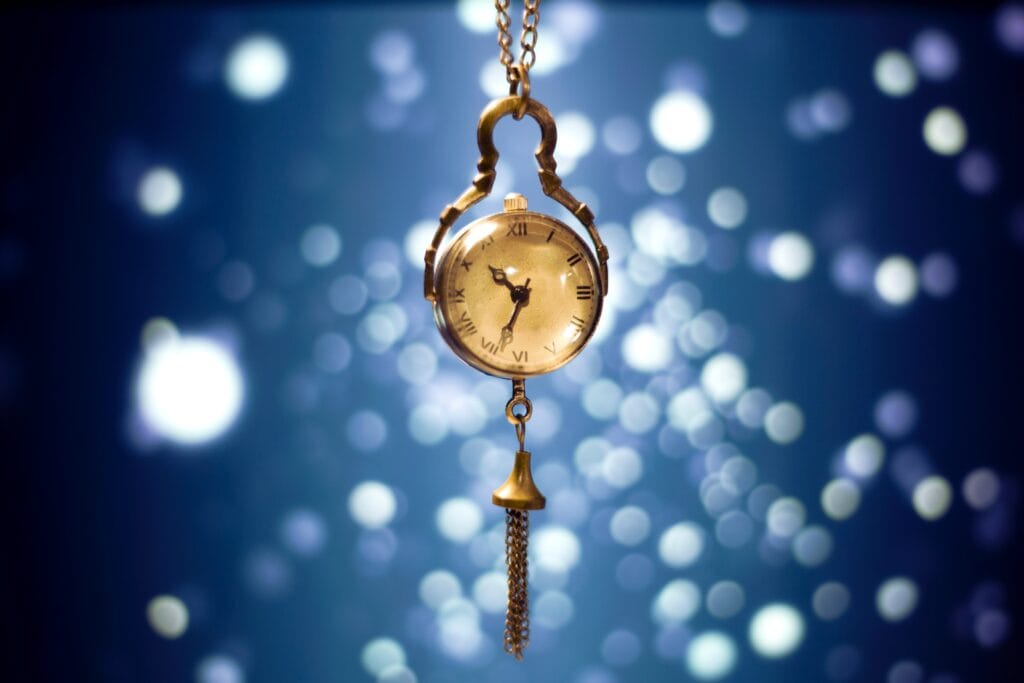 A gold pocket watch showing gregorian timekeeping