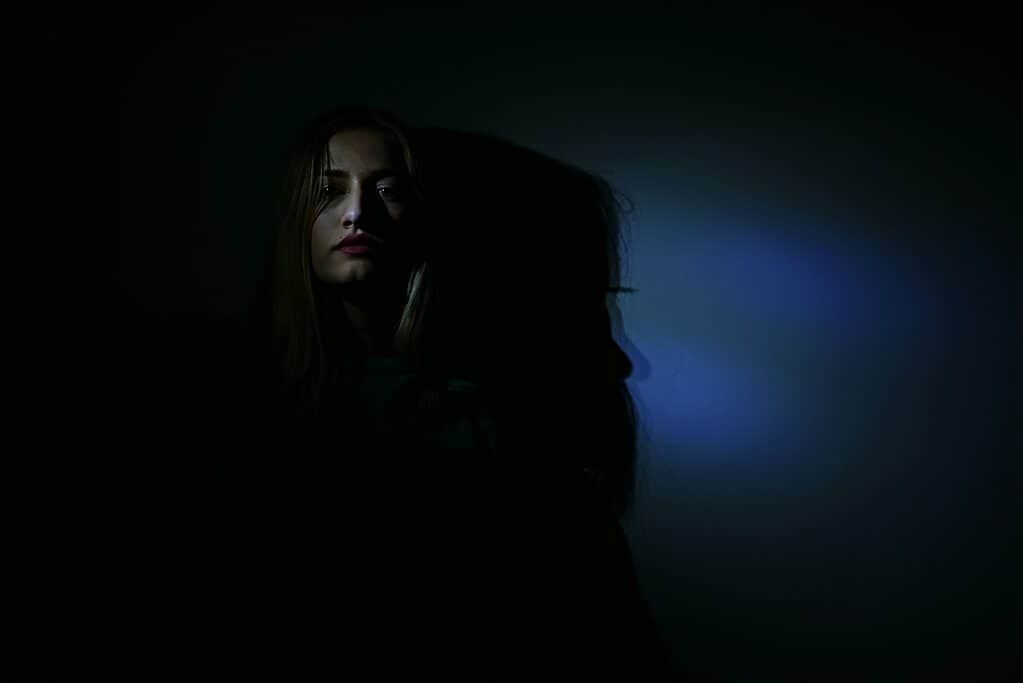 Woman in dark room